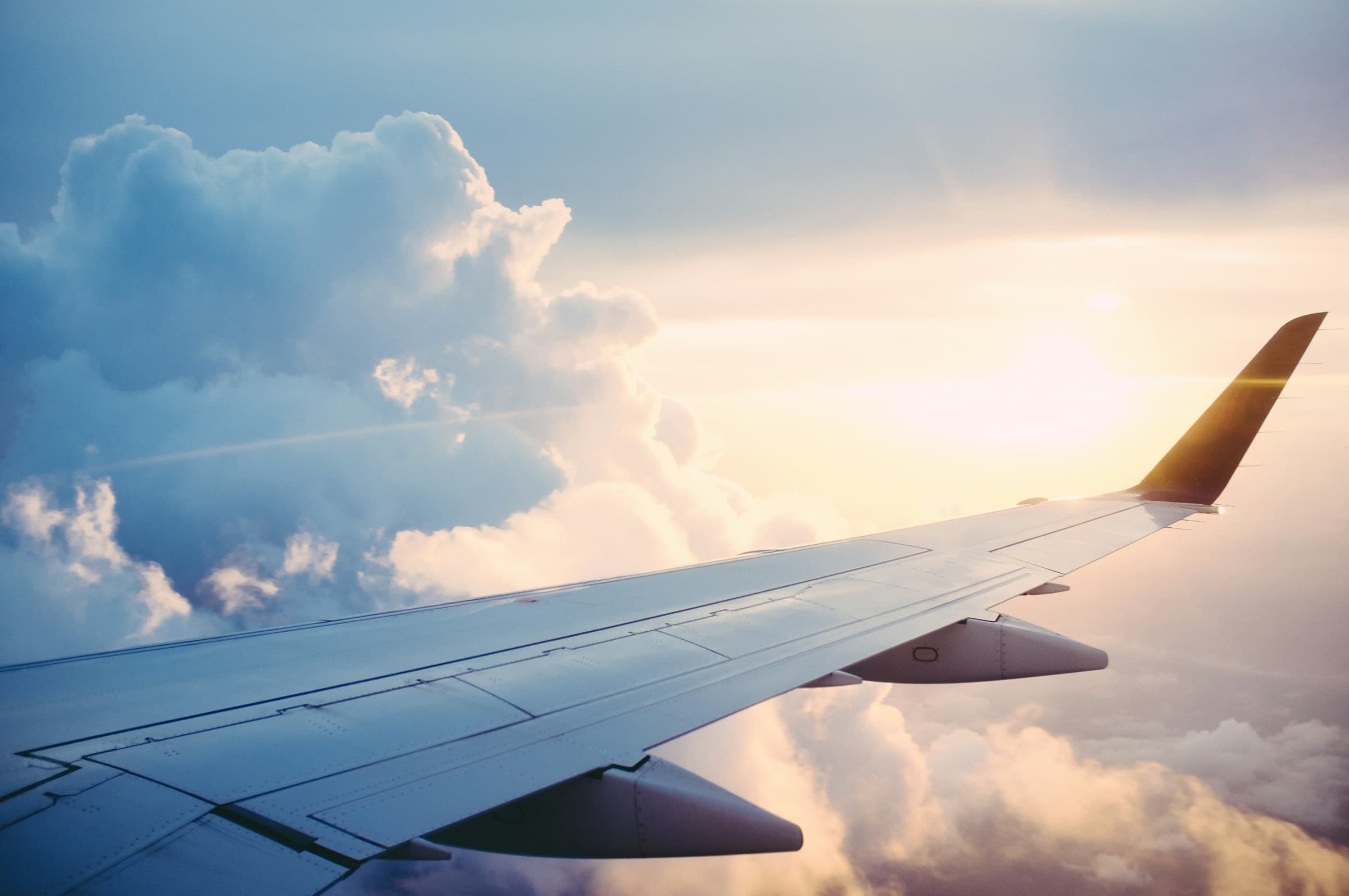 A wing above cloud at sunrise